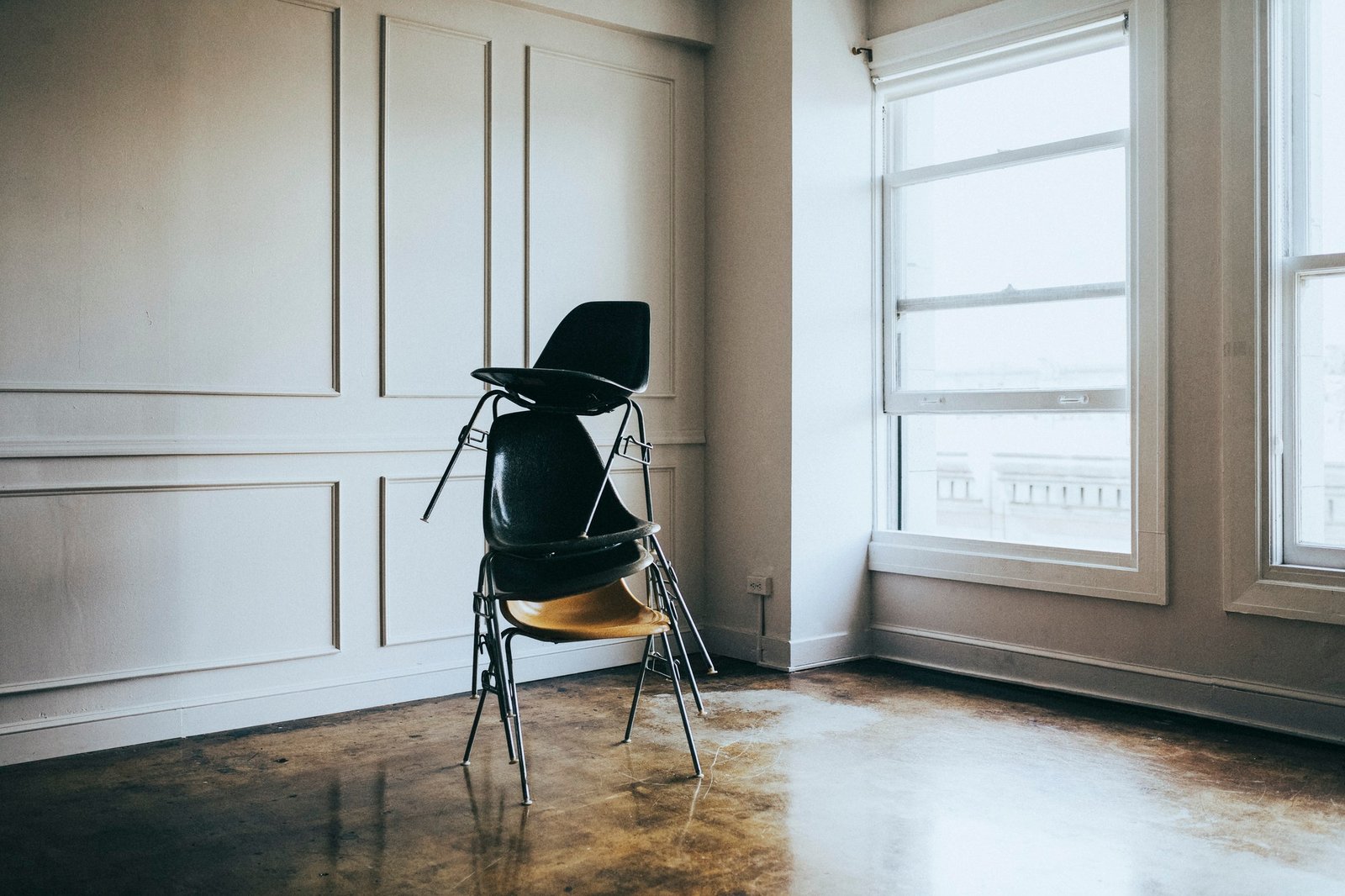stacked-chairs-in-an-empty-room.jpg